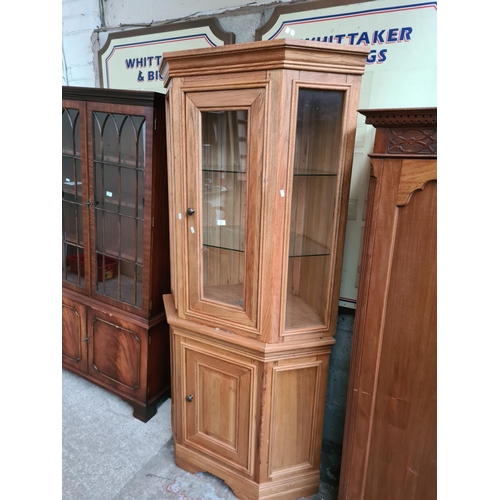 305 - A modern solid oak display cabinet