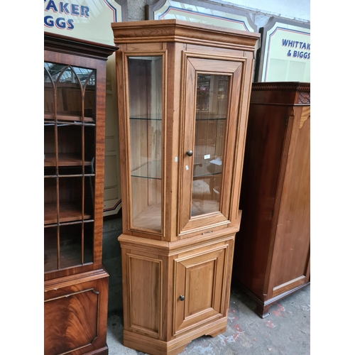 305 - A modern solid oak display cabinet