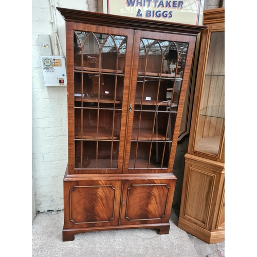 306 - A mahogany display cabinet - approx. 101cm wide x 185cm high x 35cm deep