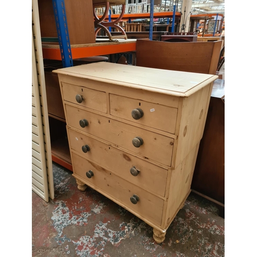 310 - A Victorian stripped pine two section chest of drawers