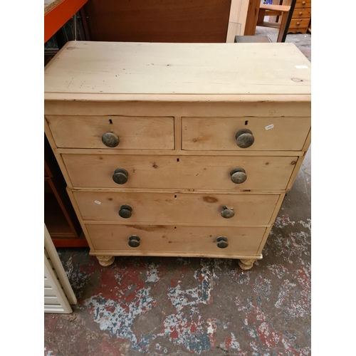 310 - A Victorian stripped pine two section chest of drawers