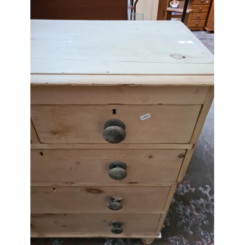 310 - A Victorian stripped pine two section chest of drawers