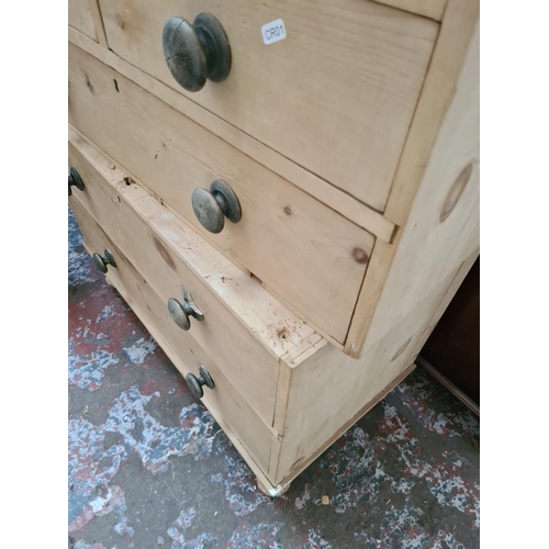 310 - A Victorian stripped pine two section chest of drawers