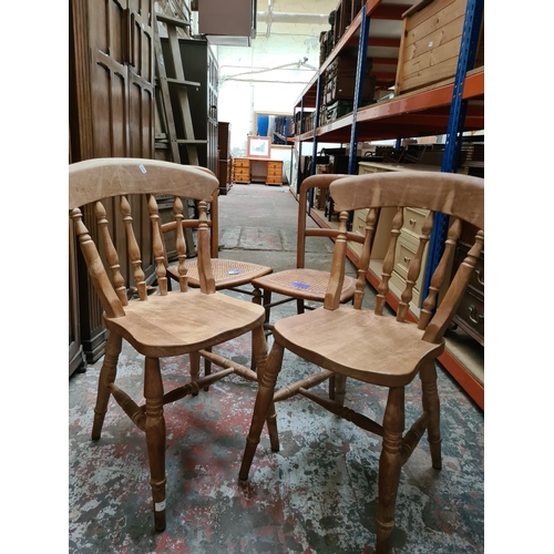 311 - Four chairs to include a pair of Edwardian rattan seated occasional chairs and a pair of pine spindl... 