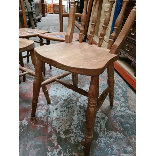 311 - Four chairs to include a pair of Edwardian rattan seated occasional chairs and a pair of pine spindl... 