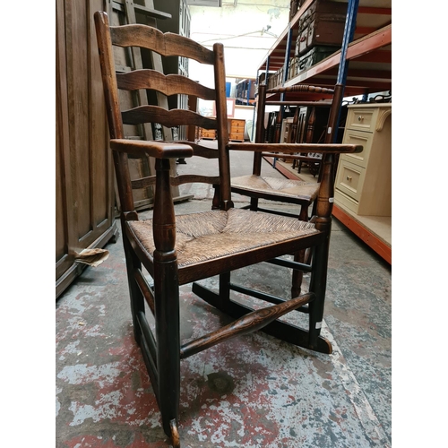 312 - Two 19th century elm farmhouse chairs with rush seats to include one rocking chair