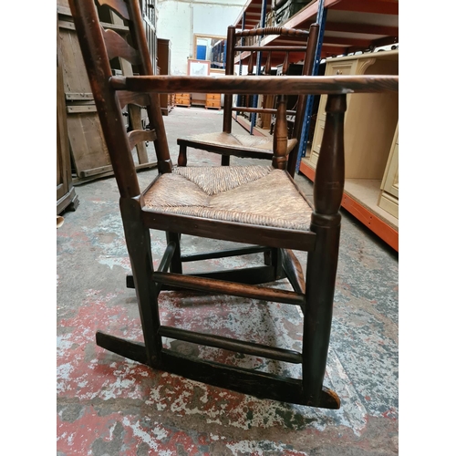 312 - Two 19th century elm farmhouse chairs with rush seats to include one rocking chair