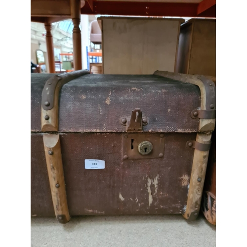 323 - A vintage brown canvas and oak banded travel trunk