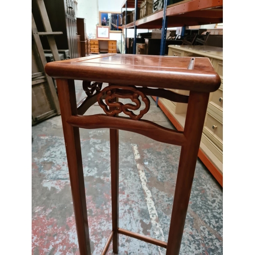 325 - A Chinese rosewood jardiniere stand