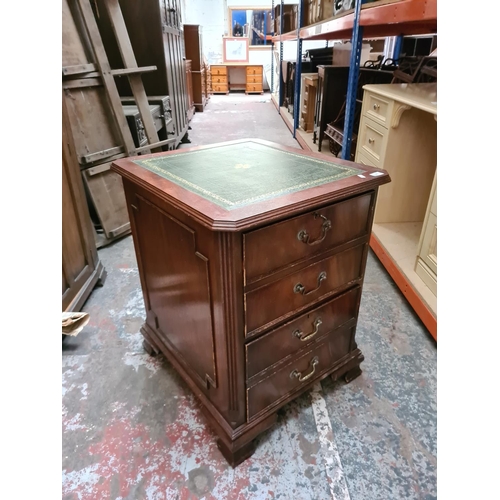 327 - A mahogany two drawer filing cabinet with green leather insert