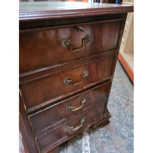 327 - A mahogany two drawer filing cabinet with green leather insert