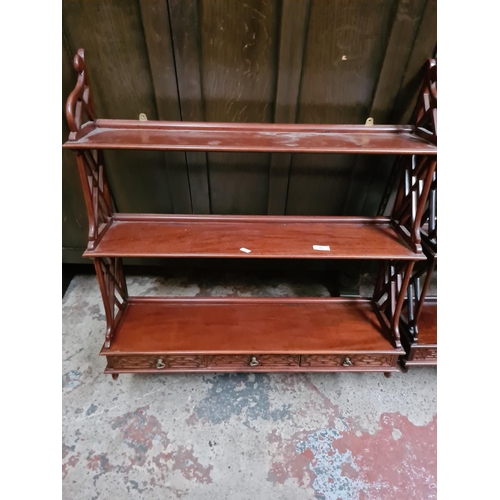 329 - A pair of mahogany wall mountable three tier shelving units