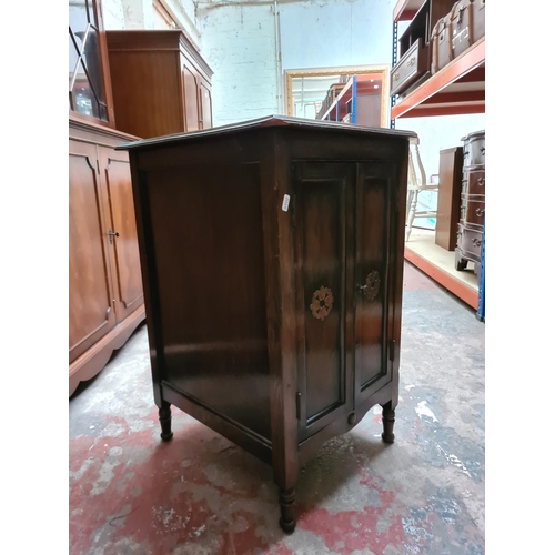 330 - A vintage oak two door cabinet