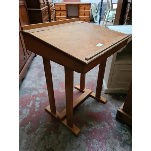 331 - Three items, a mid 20th century ply wood child's single school desk, Mexican pine bedside cabinet an... 