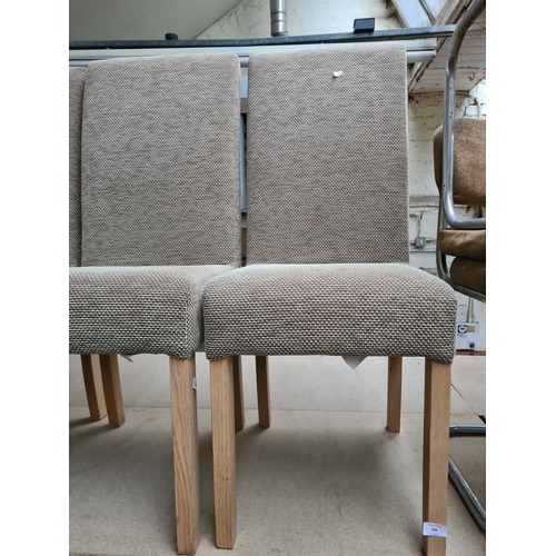 336 - A set of four brown upholstered dining chairs