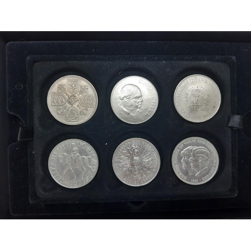 34 - Six commemorative Elizabeth II coins in Westminster collectors display case