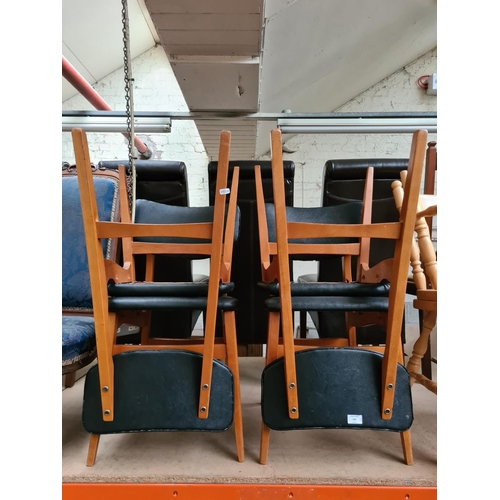 340 - A set of four mid 20th century style black leatherette dining chairs