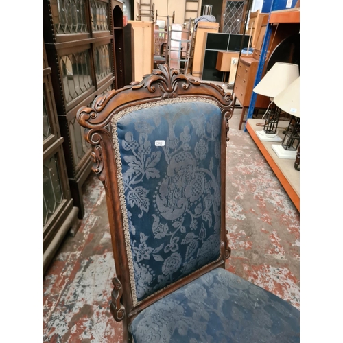 341 - A Victorian mahogany and blue upholstered nursing chair on casters