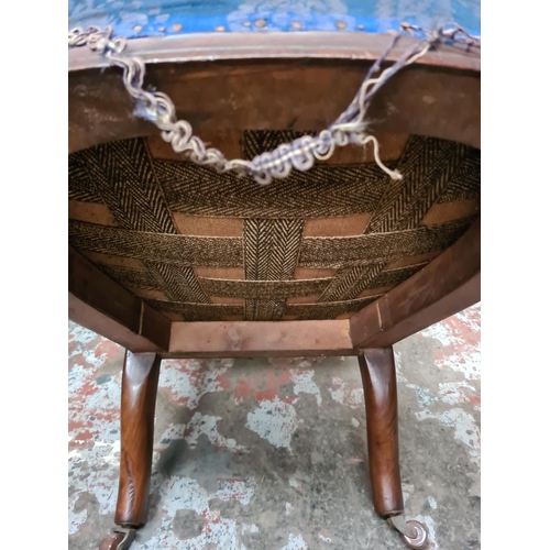 341 - A Victorian mahogany and blue upholstered nursing chair on casters