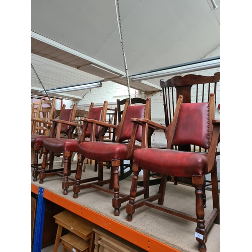 342 - A set of four Arts and Crafts style red leatherette dining chairs