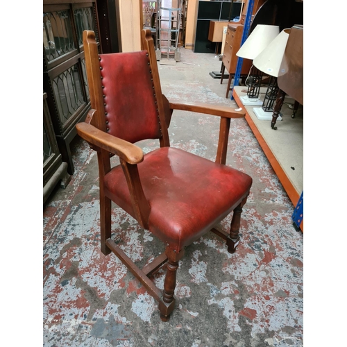 342 - A set of four Arts and Crafts style red leatherette dining chairs