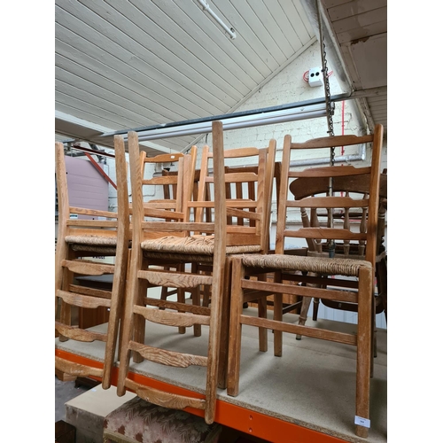 343 - A set of five elm ladder back dining chairs with rush seats