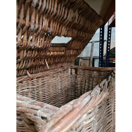 348 - An oak nest of three tables and three various wicker baskets