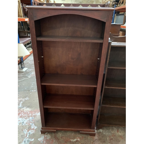 360 - Two items, an oak five tier freestanding bookcase and a mahogany effect four tier freestanding bookc... 