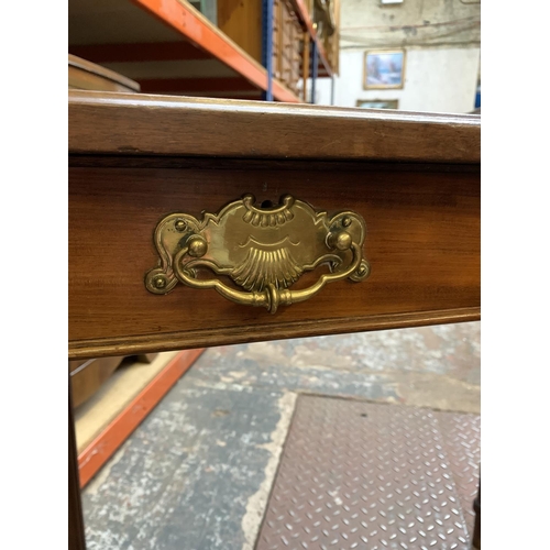 364 - A mahogany writing table with tan leather insert - approx. 77cm high x 83cm wide x 46cm deep