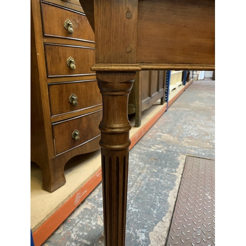 364 - A mahogany writing table with tan leather insert - approx. 77cm high x 83cm wide x 46cm deep