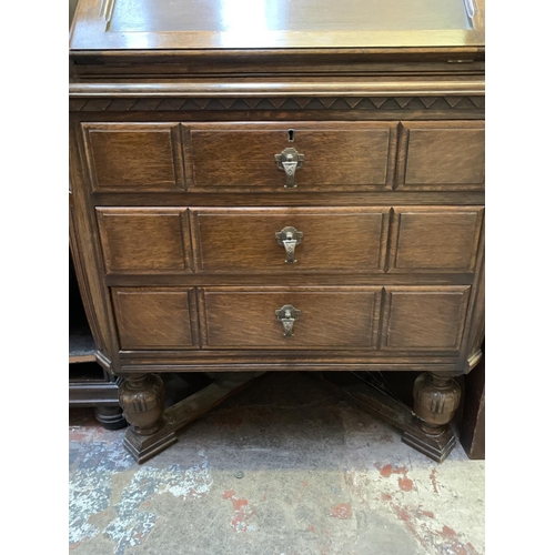 369 - An Art Deco carved oak bureau