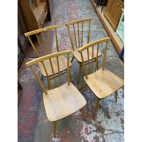 382 - A set of four Ercol elm and beech spindle back dining chairs