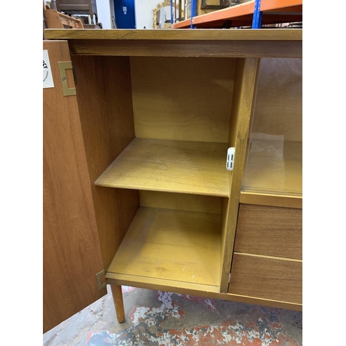 393 - A mid 20th century walnut display cabinet