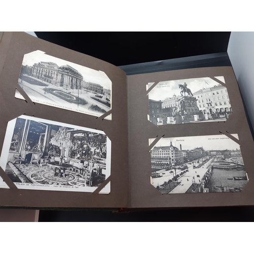 45 - A postcard album with contents to include automobilia and architectural examples