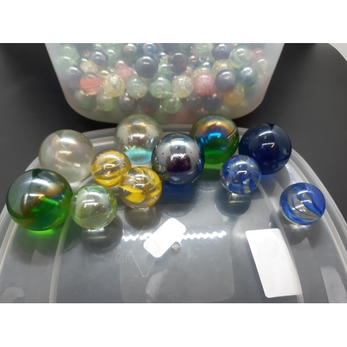 53 - A box containing a large quantity of marbles