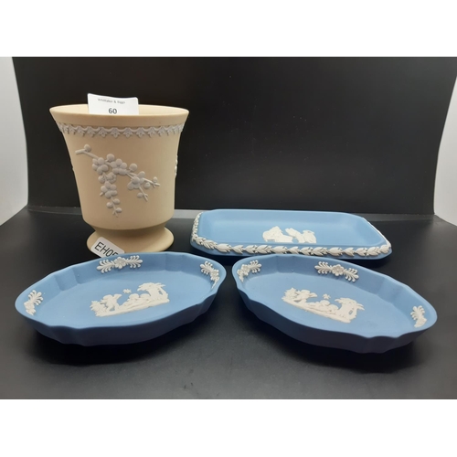 60 - Four pieces of Wedgwood Jasperware to include three pale blue trinket dishes and one yellow vase - a... 