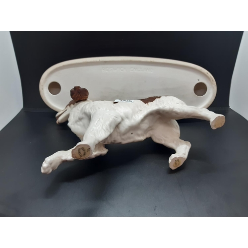 63 - A Beswick 'The Spaniel' matt porcelain figurine on plinth