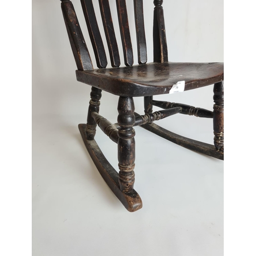 79 - A Victorian elm and beech child's rocking chair - approx. 60cm high