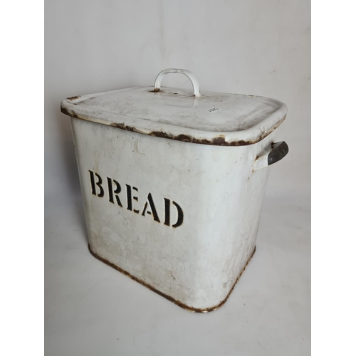 85 - Two items, a white enamel bread bin and a pair of cast iron scales with eight graduating weights