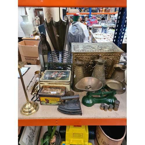 87 - Assorted metalware to include embossed brass coal box, vintage tins, brass umbrella stand, cast iron... 