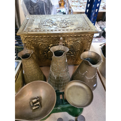 87 - Assorted metalware to include embossed brass coal box, vintage tins, brass umbrella stand, cast iron... 