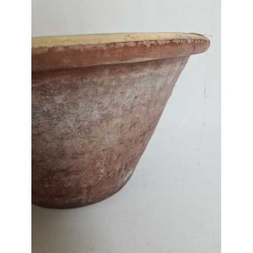 94 - A 19th century terracotta and slip glazed dairy bowl - approx. 44cm in diameter and 21cm high