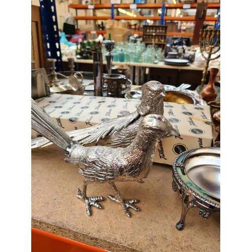 99 - Assorted metalware to include a pair of cast metal table pheasants, oval galleried tray, brass candl... 