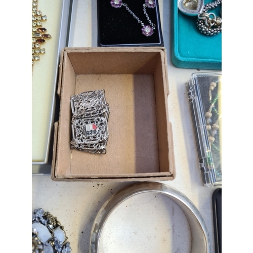 211 - A large quantity of various costume jewellery to include Sterling silver trio earring set, stamped 9... 