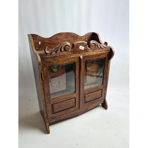 264A - An Art Nouveau oak smokers cabinet