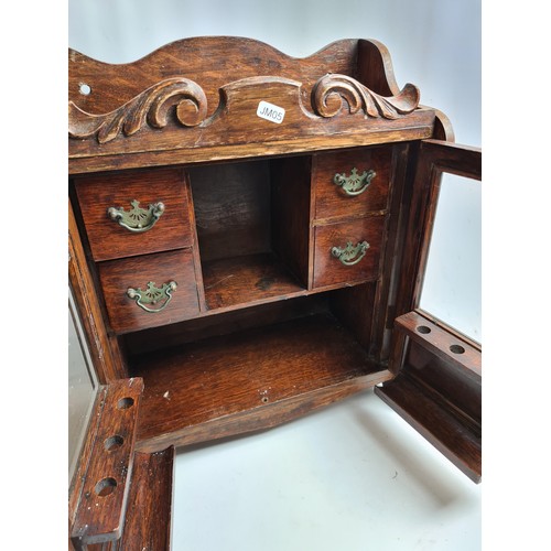 264A - An Art Nouveau oak smokers cabinet