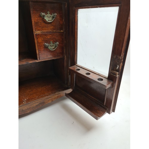 264A - An Art Nouveau oak smokers cabinet