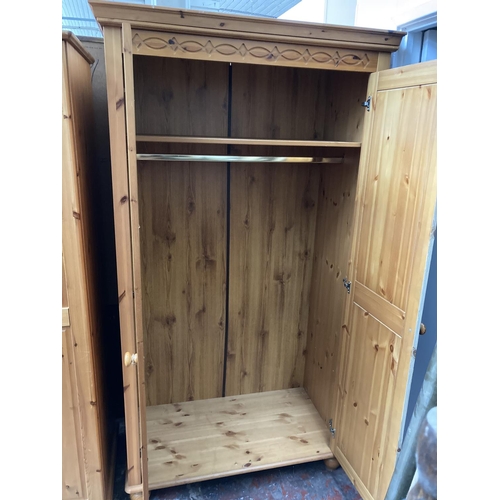 420 - A large modern pine double wardrobe