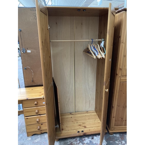 422 - A modern pine double wardrobe