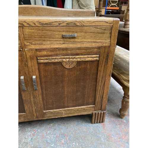 426 - An Art Deco oak sideboard - approx. 120cm wide x 98cm high x 46cm deep